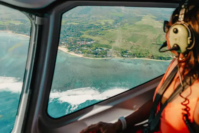 Passenger enjoying coastal views from a helicopter in Mauritius