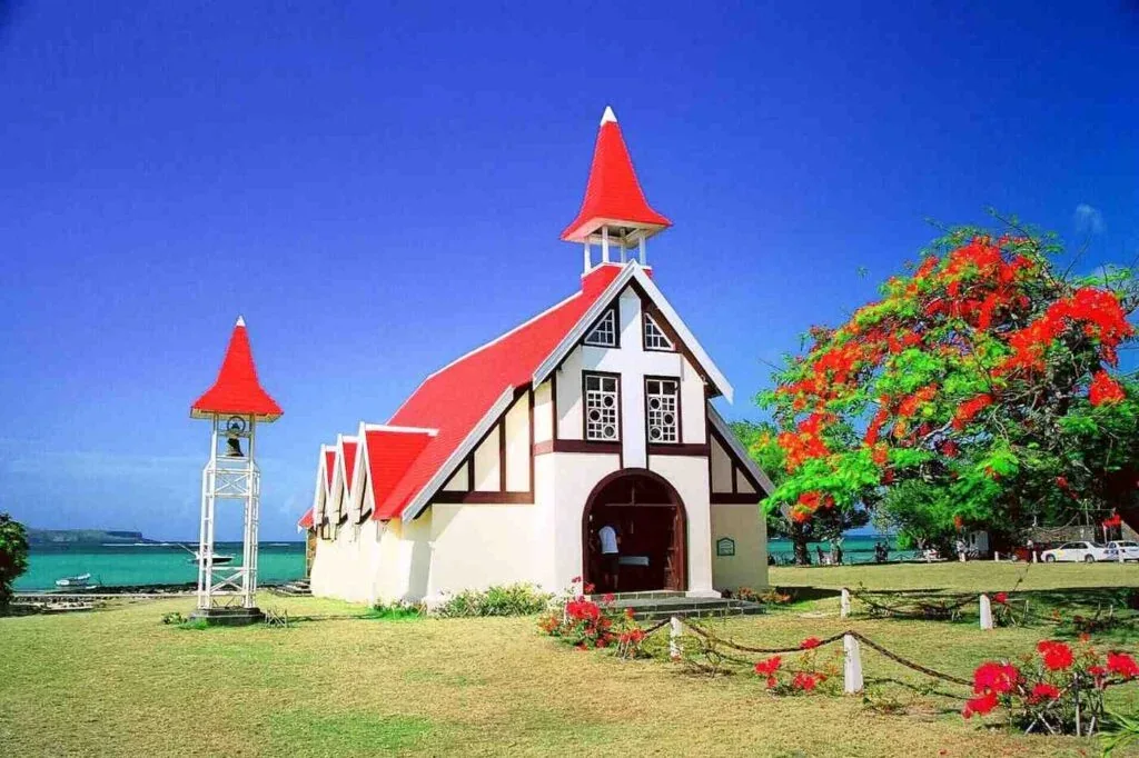 Red-roof church at Cap Malheureux beside the turquoise lagoon