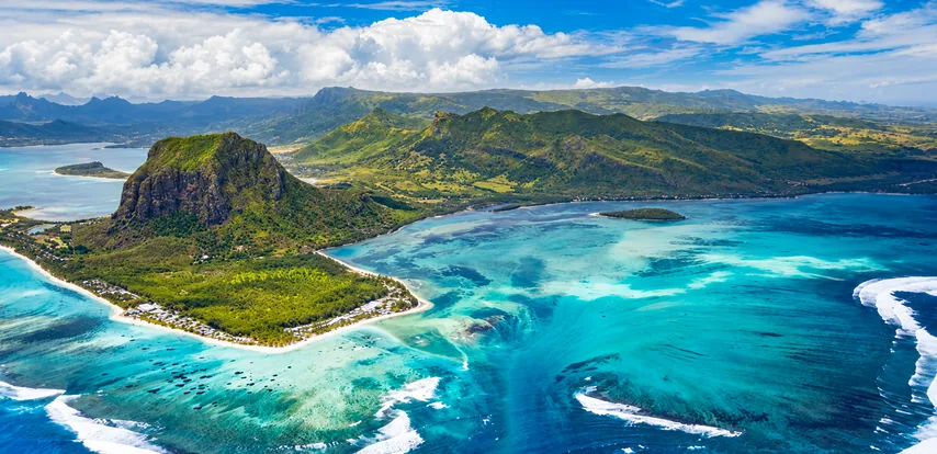 Aerial panorama of Le Morne Brabant and the turquoise lagoon in southwest Mauritius.